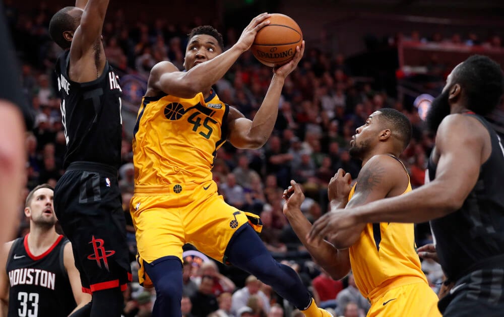Dec 7, 2017; Salt Lake City, UT, USA; Utah Jazz guard Donovan Mitchell (45) looks to shoot against Houston Rockets forward Luc Mbah a Moute (12) in the fourth quarter at Vivint Smart Home Arena. Mandatory Credit: Jeff Swinger-USA TODAY Sports