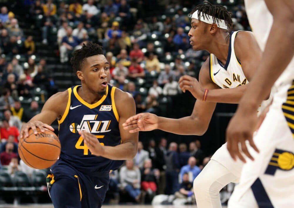 Mar 7, 2018; Indianapolis, IN, USA; Utah Jazz guard Donovan Mitchell (45) drives to the basket against Indiana Pacers center Myles Turner (33) during the fourth quarter at Bankers Life Fieldhouse. Mandatory Credit: Brian Spurlock-USA TODAY Sports