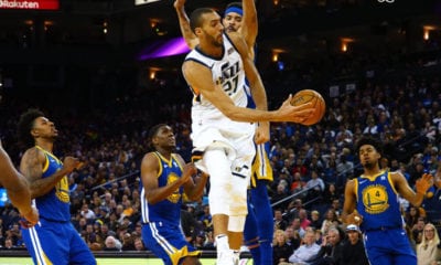 Mar 25, 2018; Oakland, CA, USA; Utah Jazz center Rudy Gobert (27) passes the ball against Golden State Warriors center JaVale McGee (1) during the third quarter at Oracle Arena. Mandatory Credit: Kelley L Cox-USA TODAY Sports