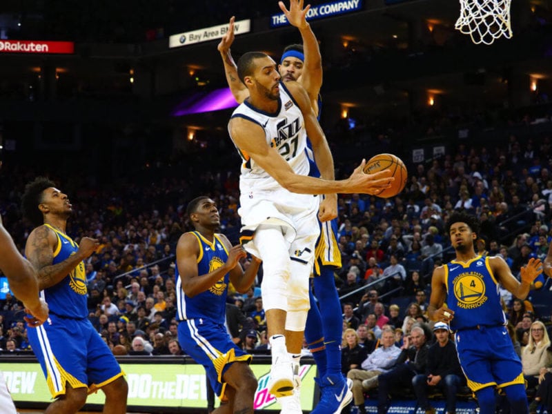 Mar 25, 2018; Oakland, CA, USA; Utah Jazz center Rudy Gobert (27) passes the ball against Golden State Warriors center JaVale McGee (1) during the third quarter at Oracle Arena. Mandatory Credit: Kelley L Cox-USA TODAY Sports